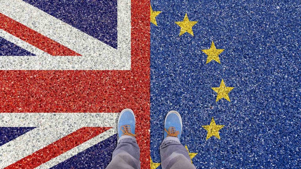 Photo of feet standing over the UK and EU flags